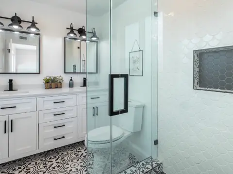 Modern bathroom with glass shower and double vanity